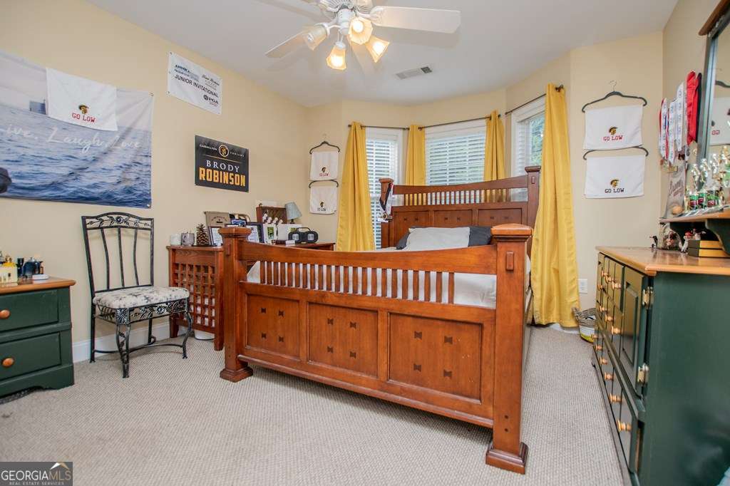 204 Pinehurst Way Carrollton, GA 30116 - Photo 27 of 61 a view of a bedroom with furniture window and fireplace
