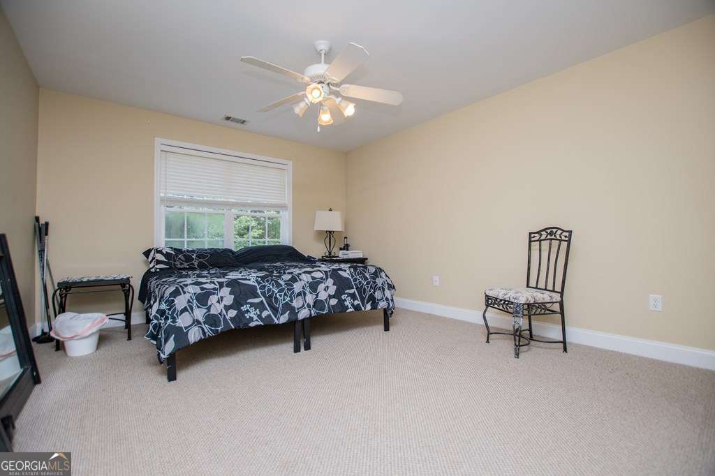 204 Pinehurst Way Carrollton, GA 30116 - Photo 30 of 61 a bedroom with a bed chair and window