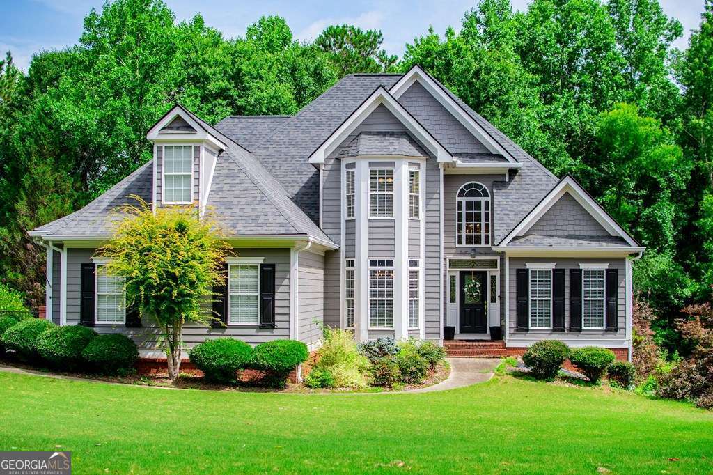 204 Pinehurst Way Carrollton, GA 30116 - Photo 3 of 61 a front view of a house with a yard and porch