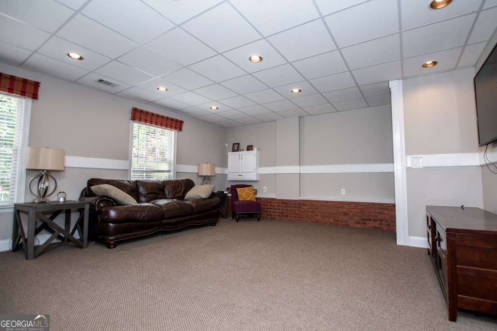 204 Pinehurst Way Carrollton, GA 30116 - Photo 39 of 61 a living room with furniture and a window
