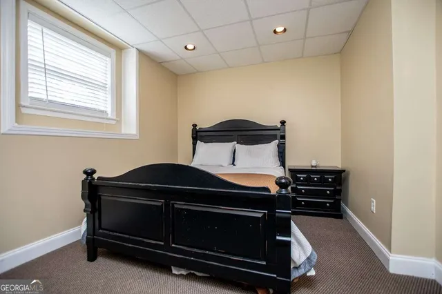 a view of a house with a yard and sitting area