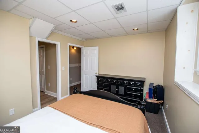 a view of a house with a yard and sitting area