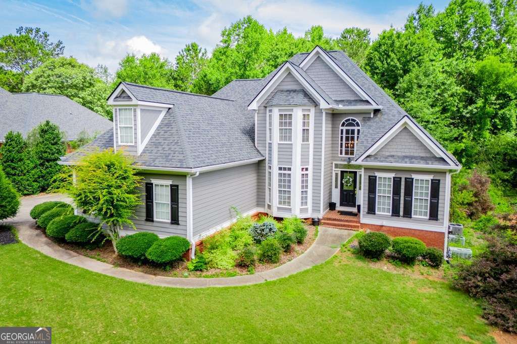 204 Pinehurst Way Carrollton, GA 30116 - Photo 58 of 61 a front view of a house with a yard and green space