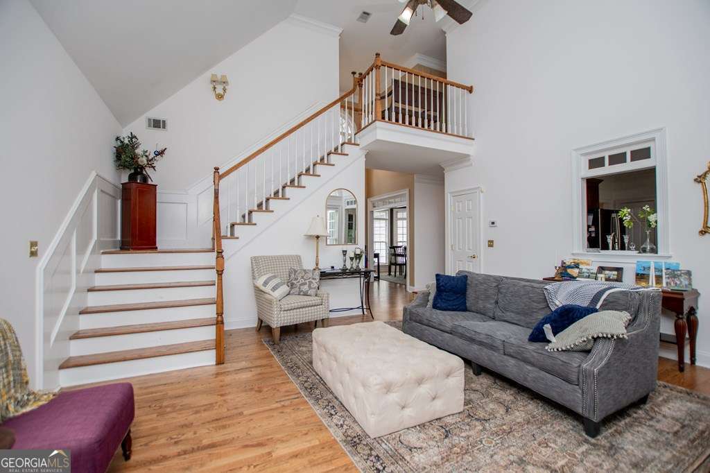 204 Pinehurst Way Carrollton, GA 30116 - Photo 10 of 61 a living room with furniture and a stairs