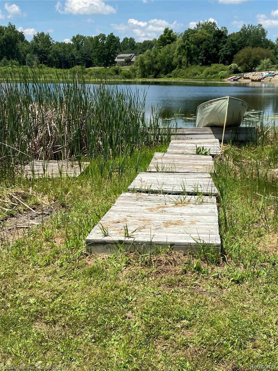 1697 North Hughes Road Howell, MI 48843 - Photo 20 of 61 LOGAN LAKE DOCK