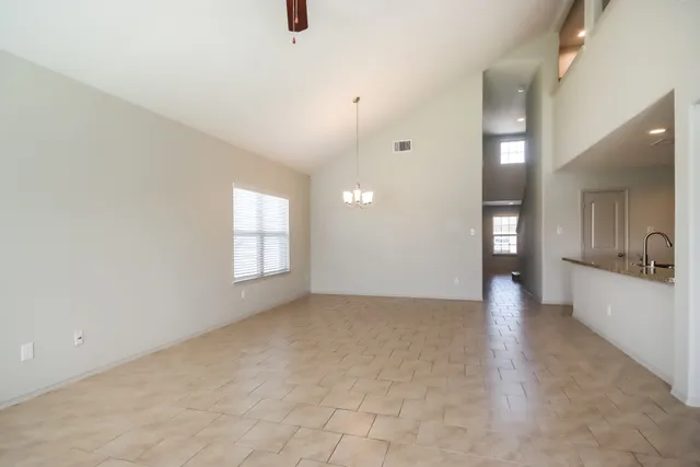 a kitchen with stainless steel appliances granite countertop a sink stove and microwave