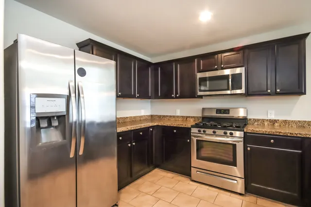 a view of an empty room with a fan