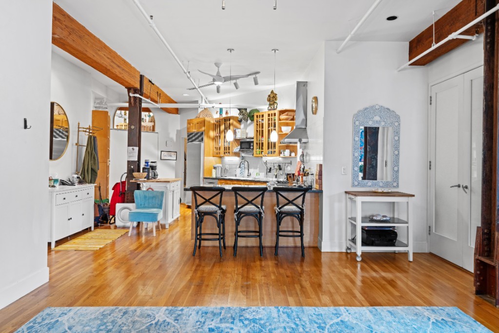 165 Duane Street, Unit 6A Manhattan, NY 10013 - Photo 13 of 29 a living room with furniture and a fireplace