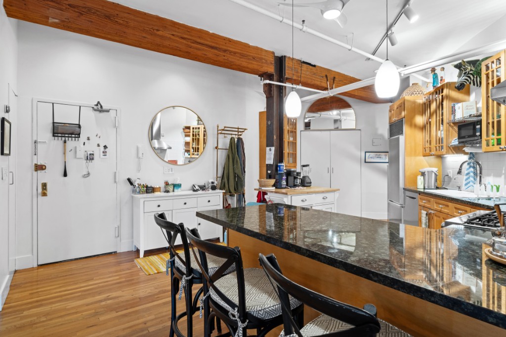 165 Duane Street, Unit 6A Manhattan, NY 10013 - Photo 14 of 29 a view of dining table chairs and chandelier