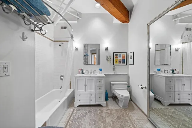 a bathroom with a sink a toilet and bathtub
