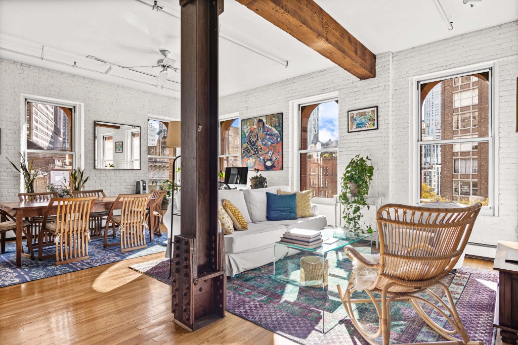 165 Duane Street, Unit 6A Manhattan, NY 10013 - Photo 4 of 29 a living room with furniture and wooden floor