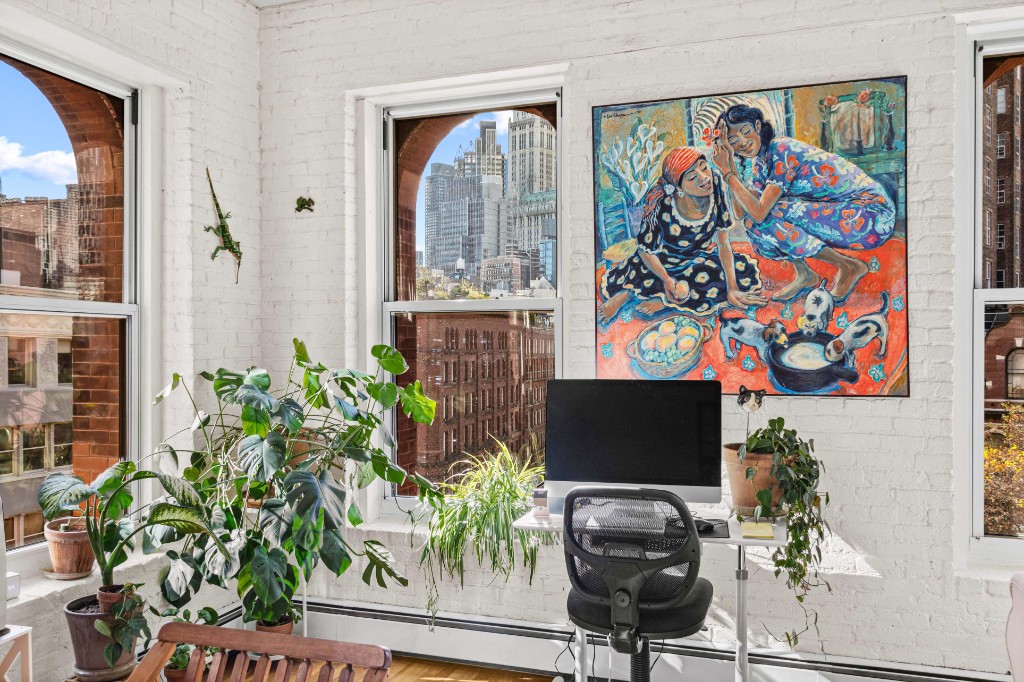 165 Duane Street, Unit 6A Manhattan, NY 10013 - Photo 8 of 29 a living room filled with furniture and a potted plant