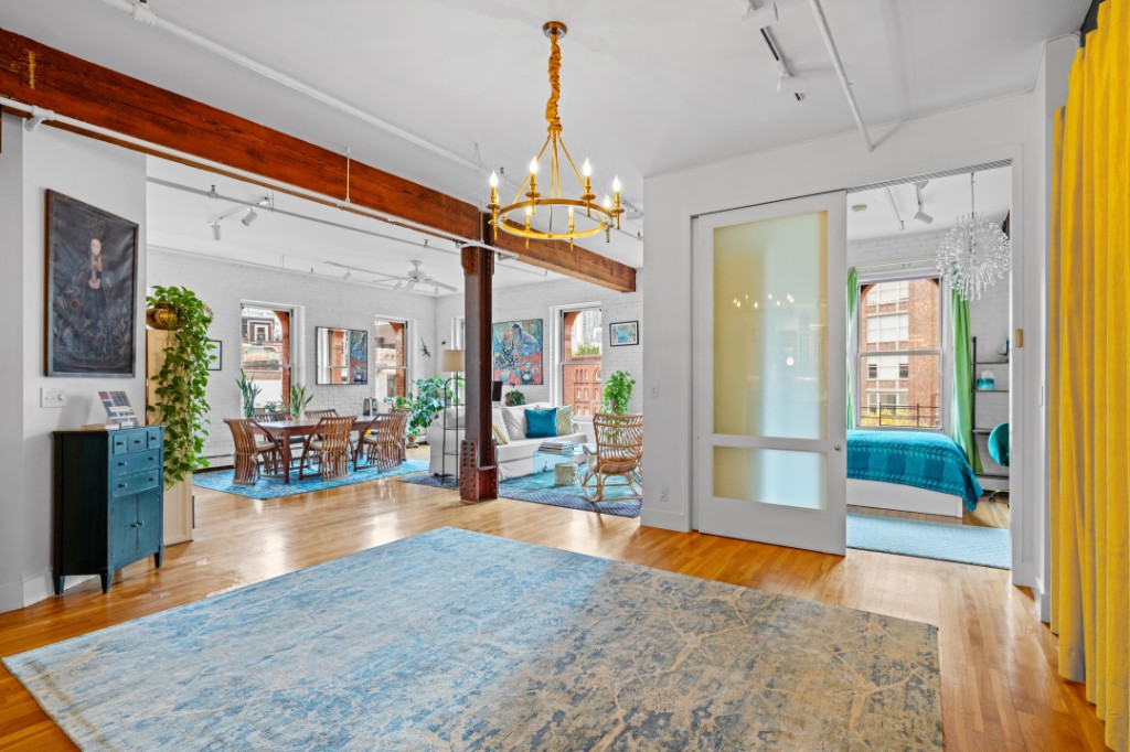 165 Duane Street, Unit 6A Manhattan, NY 10013 - Photo 9 of 29 a view of a livingroom kitchen and dining room view