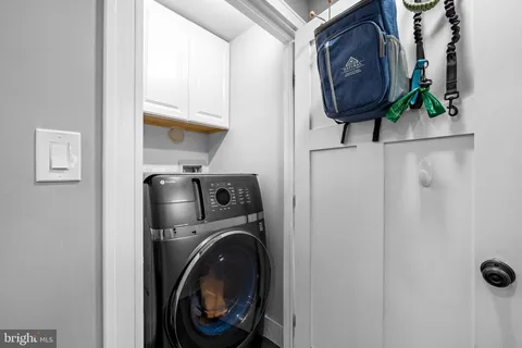 a view of storage and utility room with washer and dryer