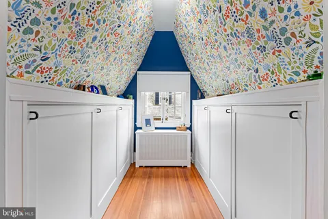 a view of kitchen with furniture and refrigerator