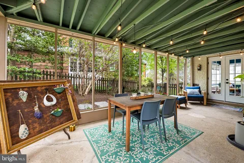 a outdoor dining space with furniture and outdoor view