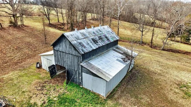 a dining room with furniture and a kitchen view