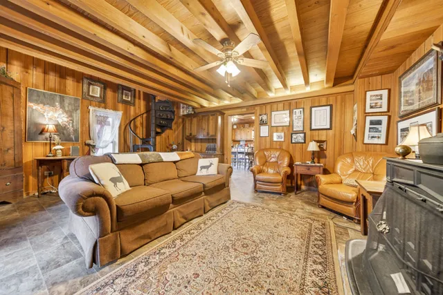 a view of a bedroom with two beds and potted plant