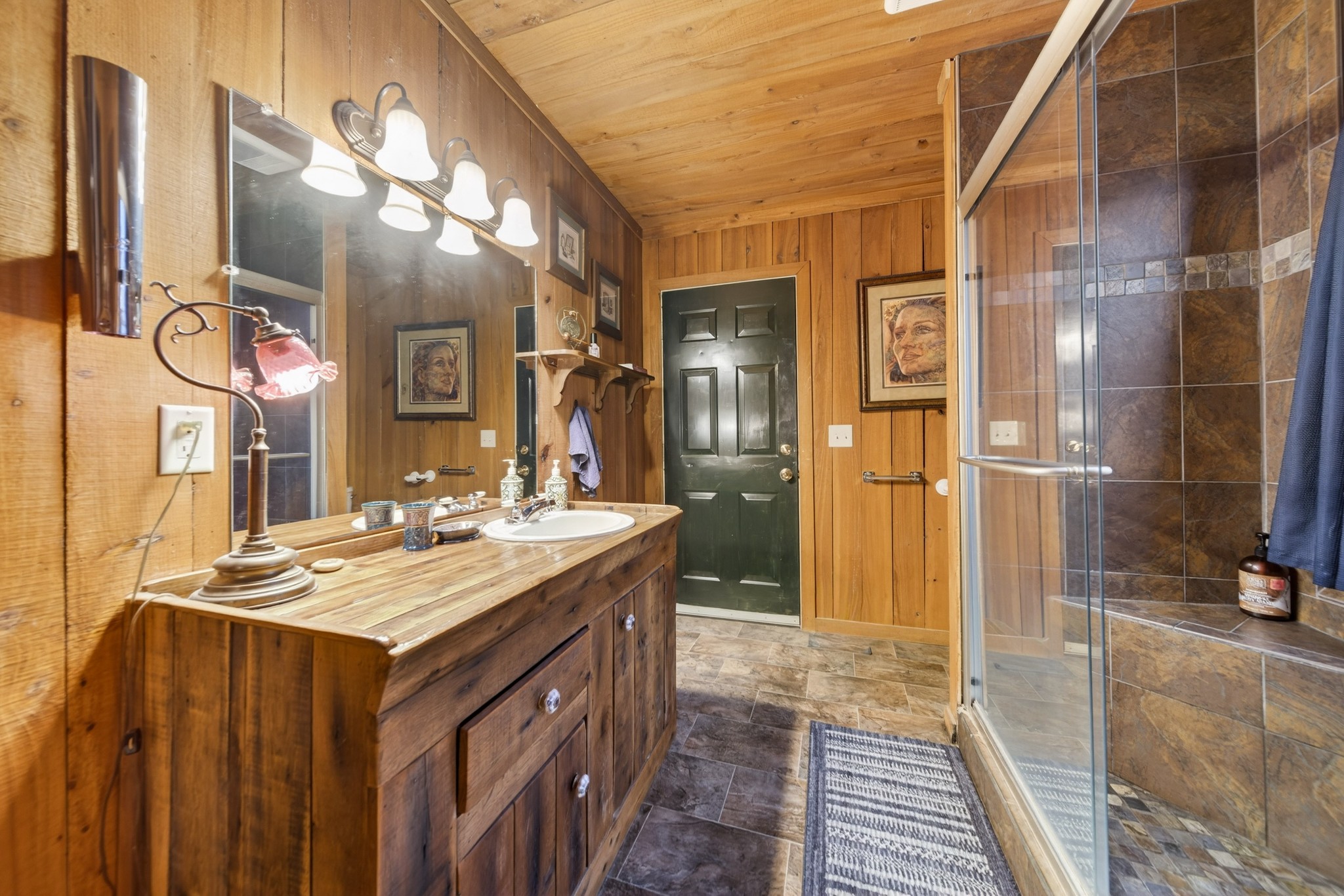 5084 Dorris Road Greenbrier, TN 37073 - Photo 35 of 89 a bathroom with a sink a mirror and a shower