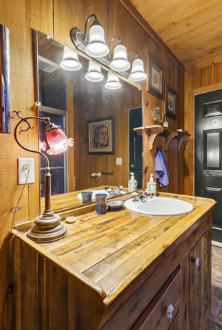 a green field with trees in the background