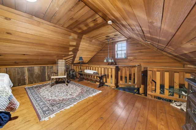 a view of a yard with wooden fence