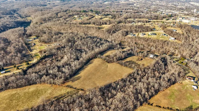 a view of swimming pool of water with yard and outdoor seating