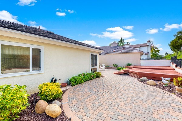 24941 Danamaple Dana Point, CA 92629 - Photo 24 of 28 a front view of a house with a yard and a garden