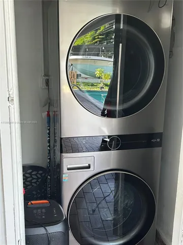 swimming pool view with a seating space
