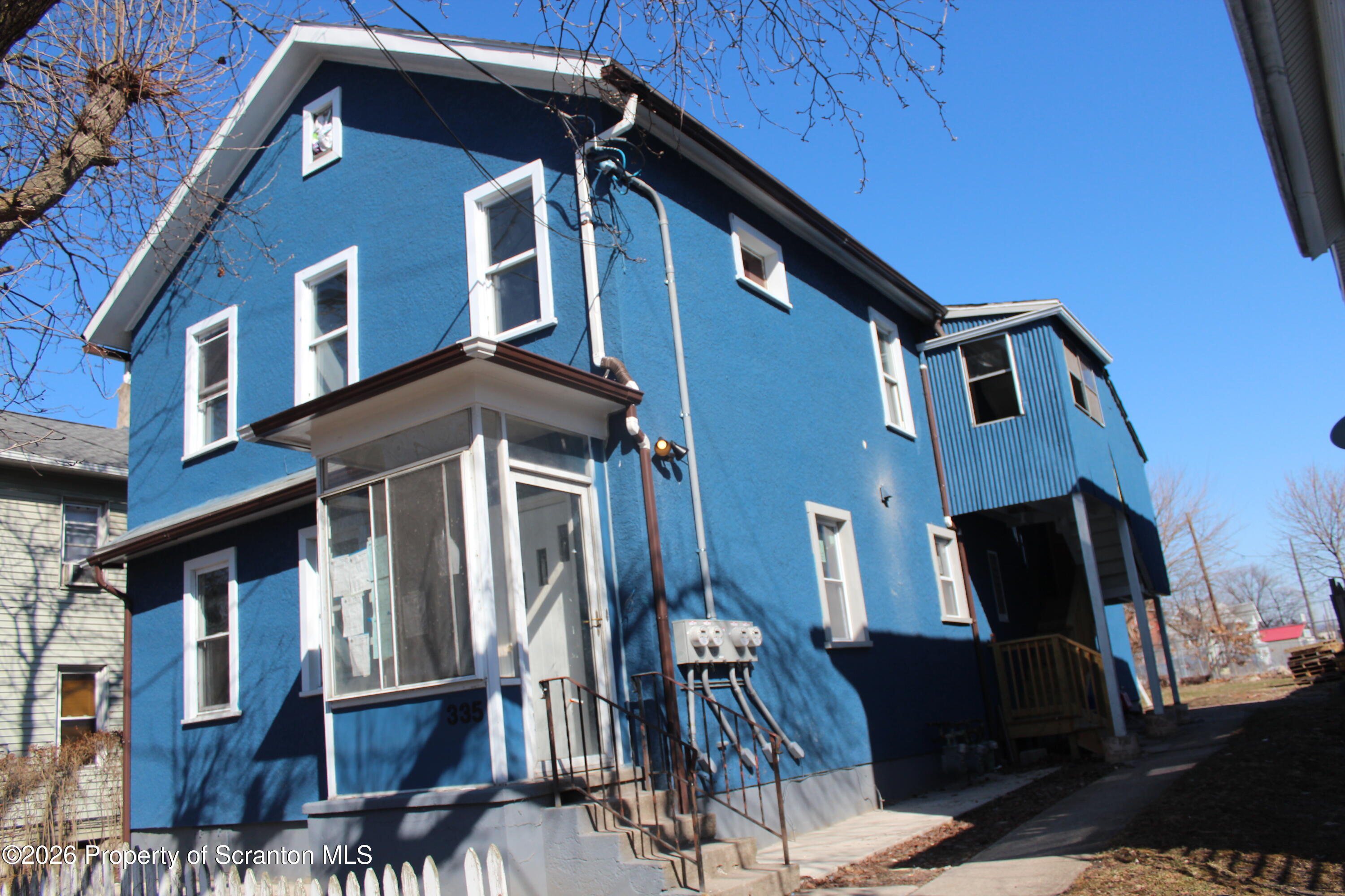 335 Phelps Street, Unit 1 Scranton, PA 18509 - Photo 2 of 12 a front view of a house with many windows