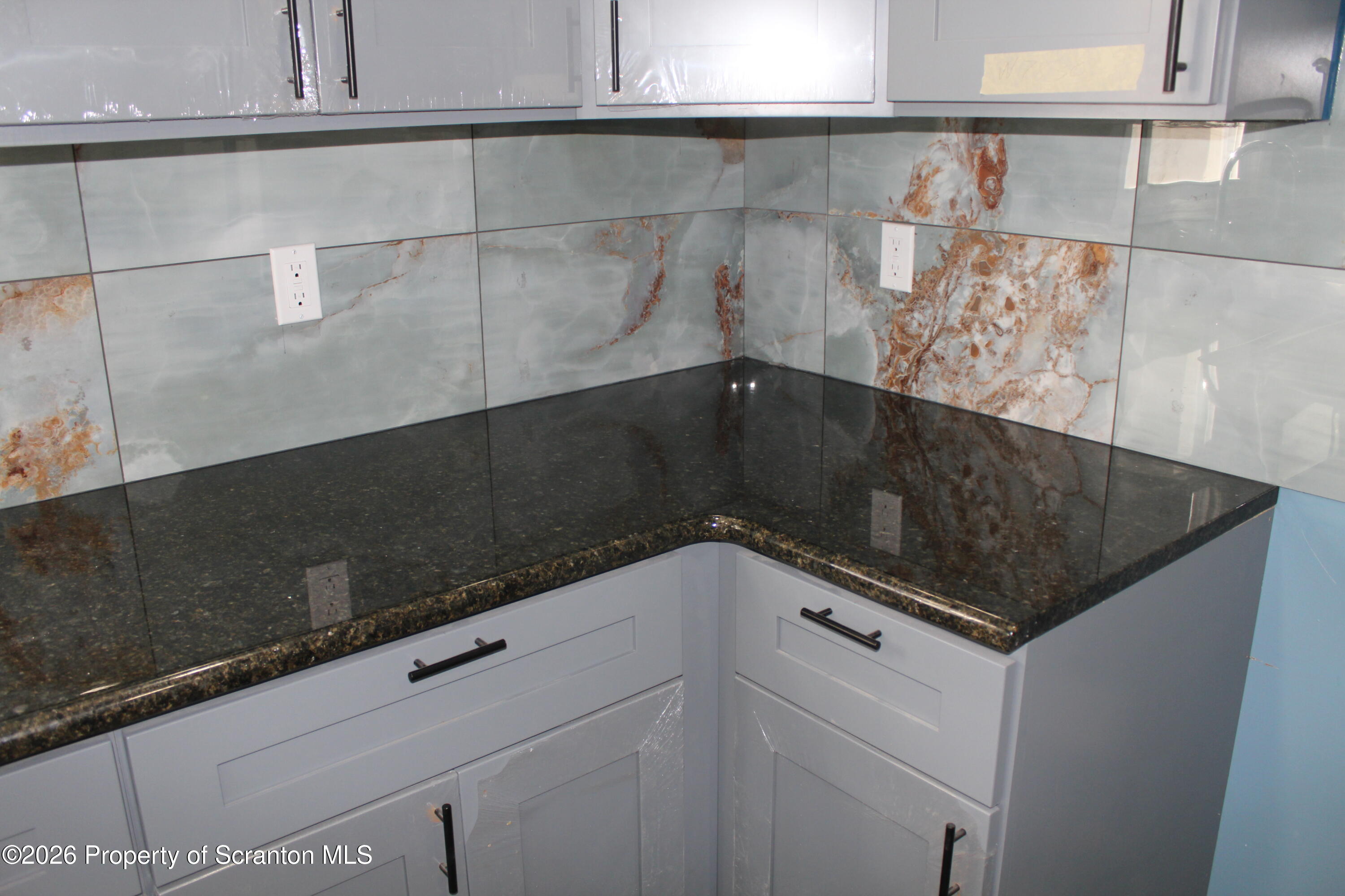 335 Phelps Street, Unit 1 Scranton, PA 18509 - Photo 5 of 12 a close view of kitchen stove and cabinets