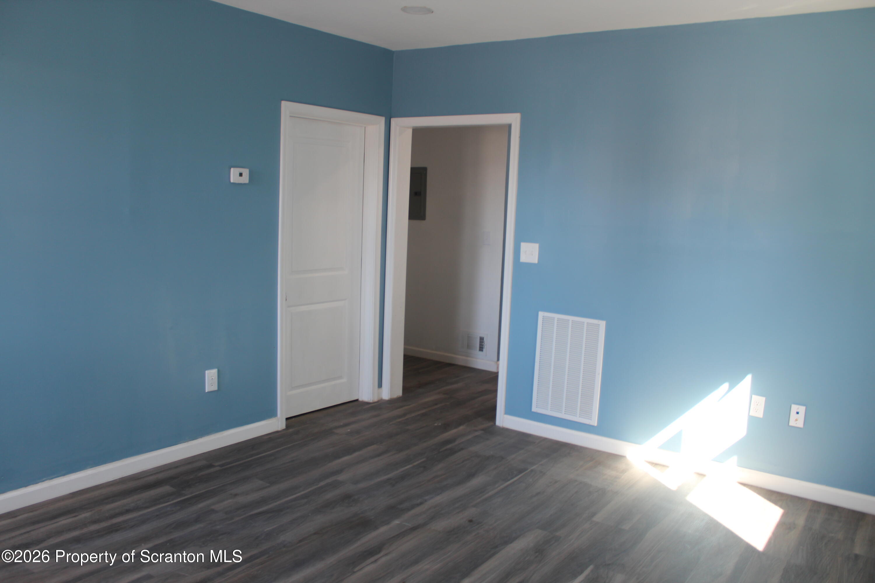 335 Phelps Street, Unit 1 Scranton, PA 18509 - Photo 8 of 12 a view of an empty room with wooden floor