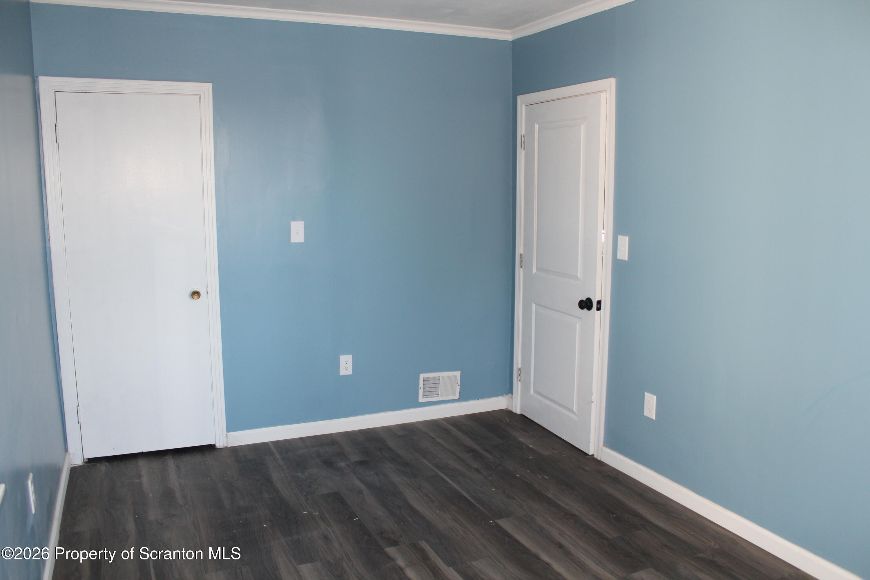 335 Phelps Street, Unit 1 Scranton, PA 18509 - Photo 9 of 12 a view of an empty room with wooden floor