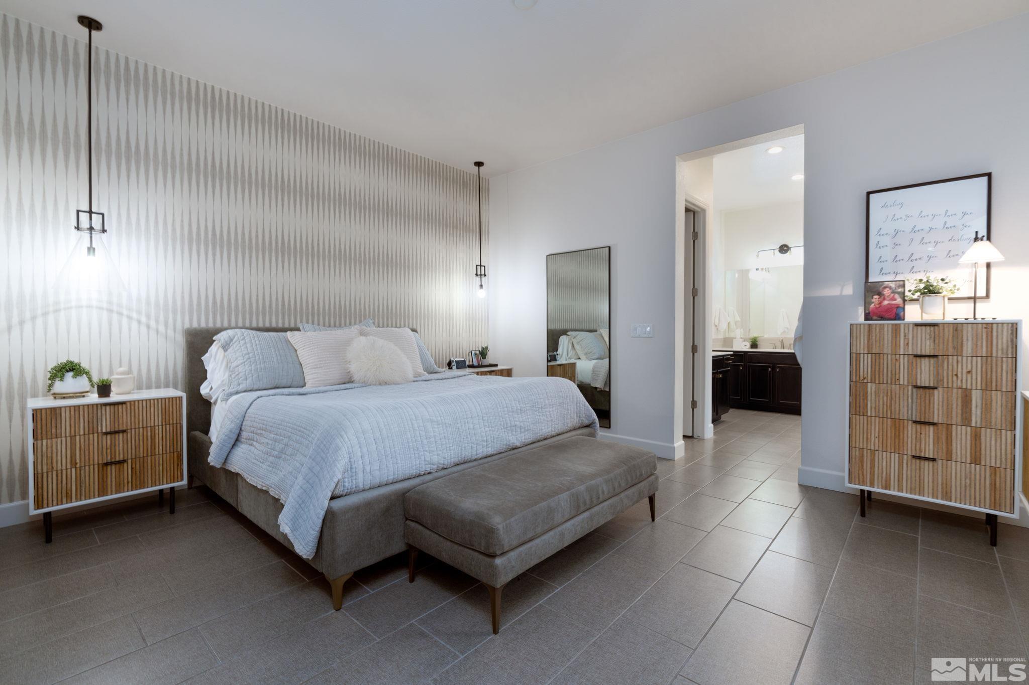 2343 Iron Square Drive Reno, NV 89521 - Photo 15 of 35 a spacious bedroom with a bed and cabinets