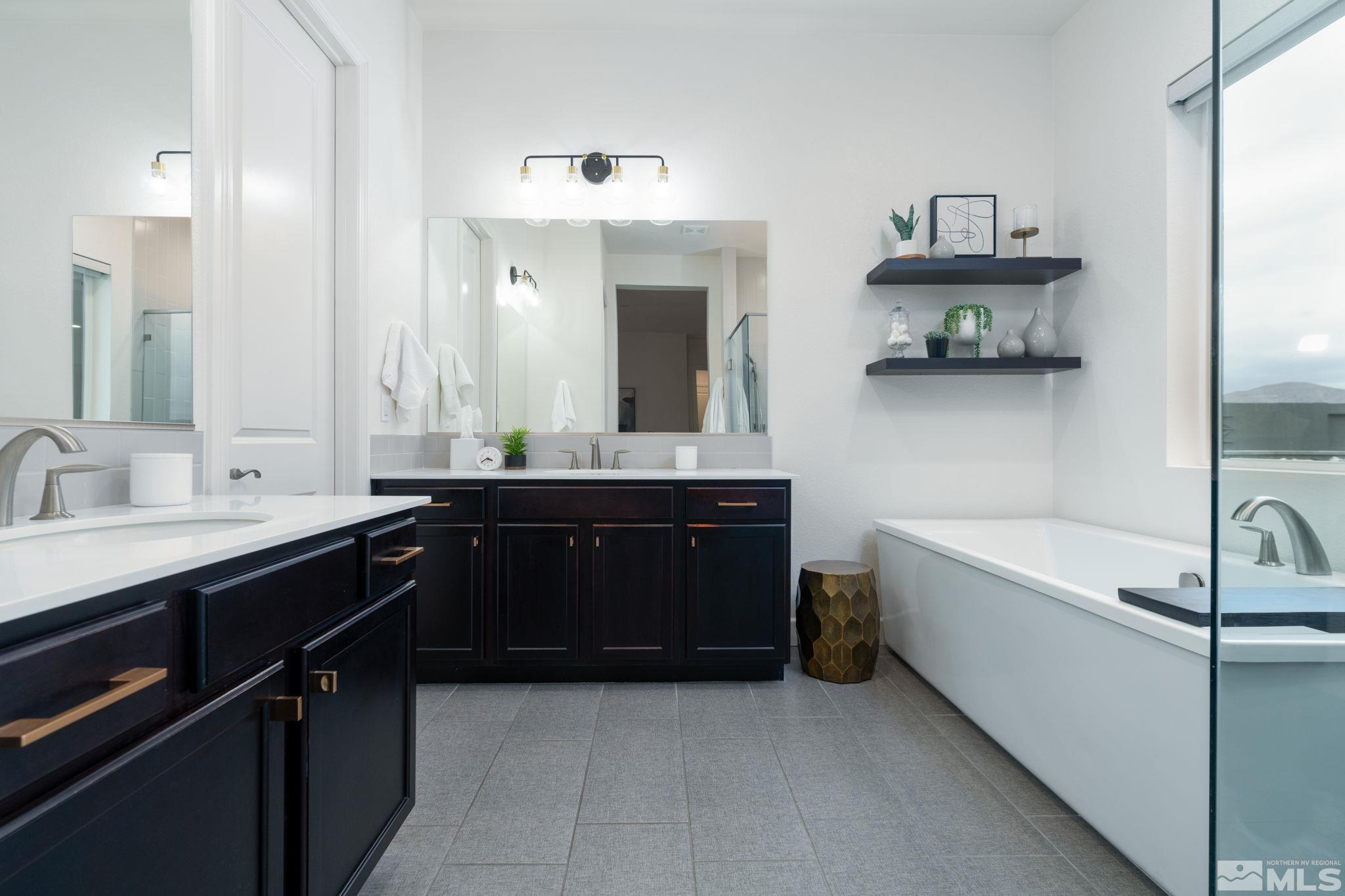 2343 Iron Square Drive Reno, NV 89521 - Photo 17 of 35 a bathroom with a tub double sink and mirror