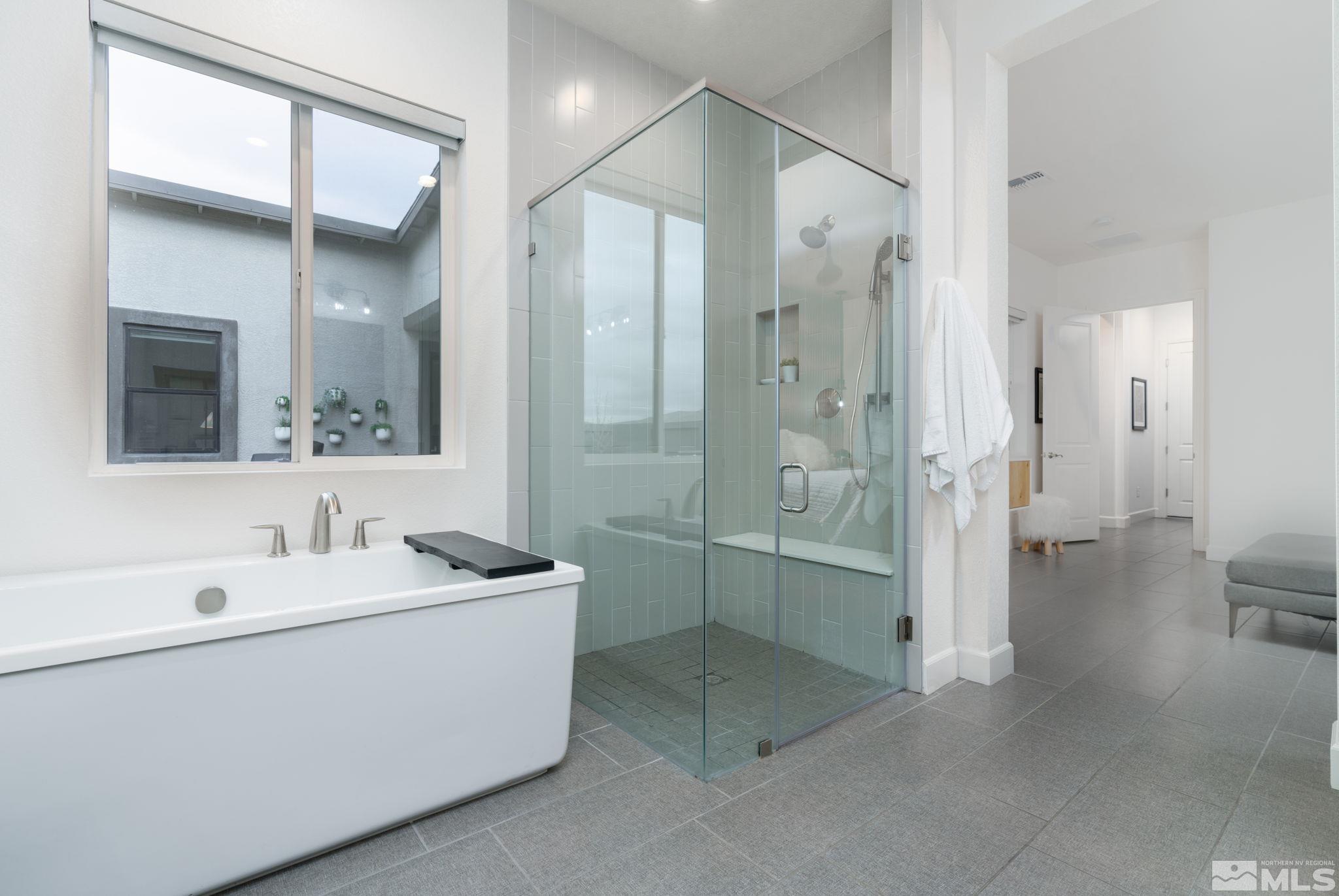 2343 Iron Square Drive Reno, NV 89521 - Photo 18 of 35 a bathroom with a double vanity sink mirror and shower