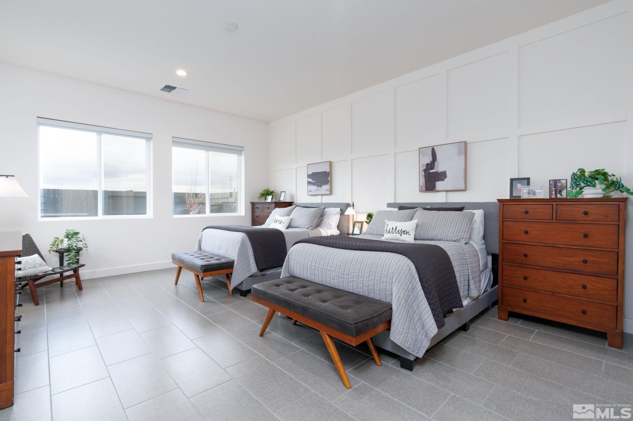 2343 Iron Square Drive Reno, NV 89521 - Photo 19 of 35 a spacious bedroom with a bed and window