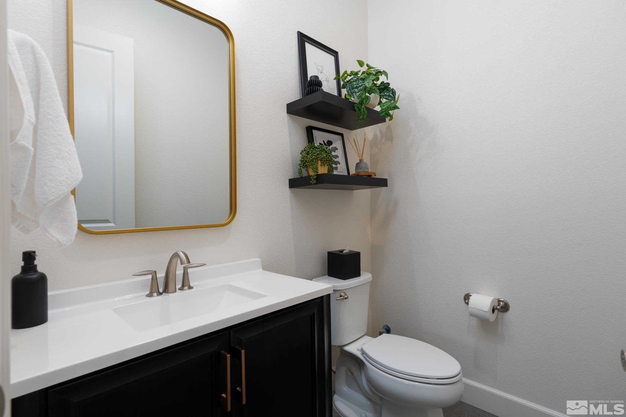 2343 Iron Square Drive Reno, NV 89521 - Photo 20 of 35 a bathroom with a toilet sink and mirror