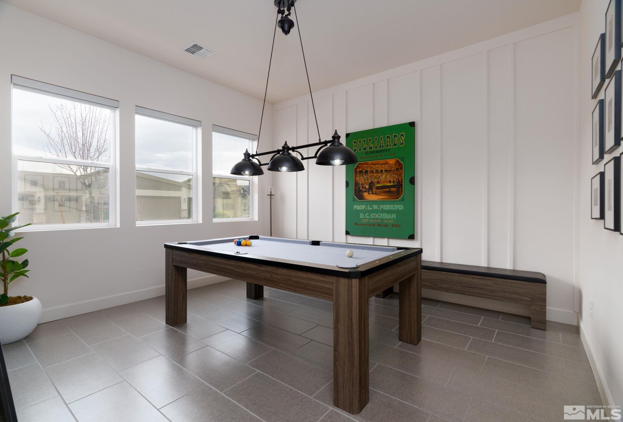 2343 Iron Square Drive Reno, NV 89521 - Photo 22 of 35 a view of a kitchen with kitchen island a sink a stove and a window