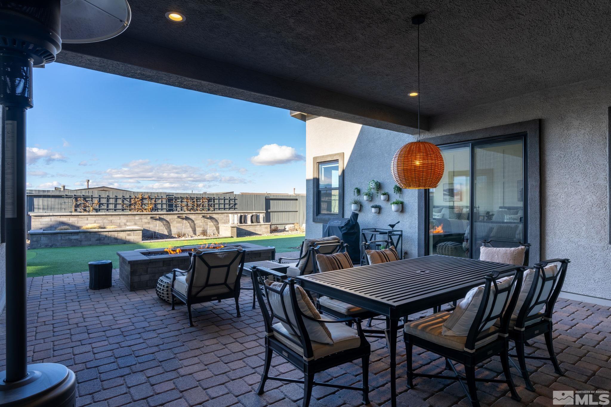 2343 Iron Square Drive Reno, NV 89521 - Photo 24 of 35 a view of a patio with a table and chairs