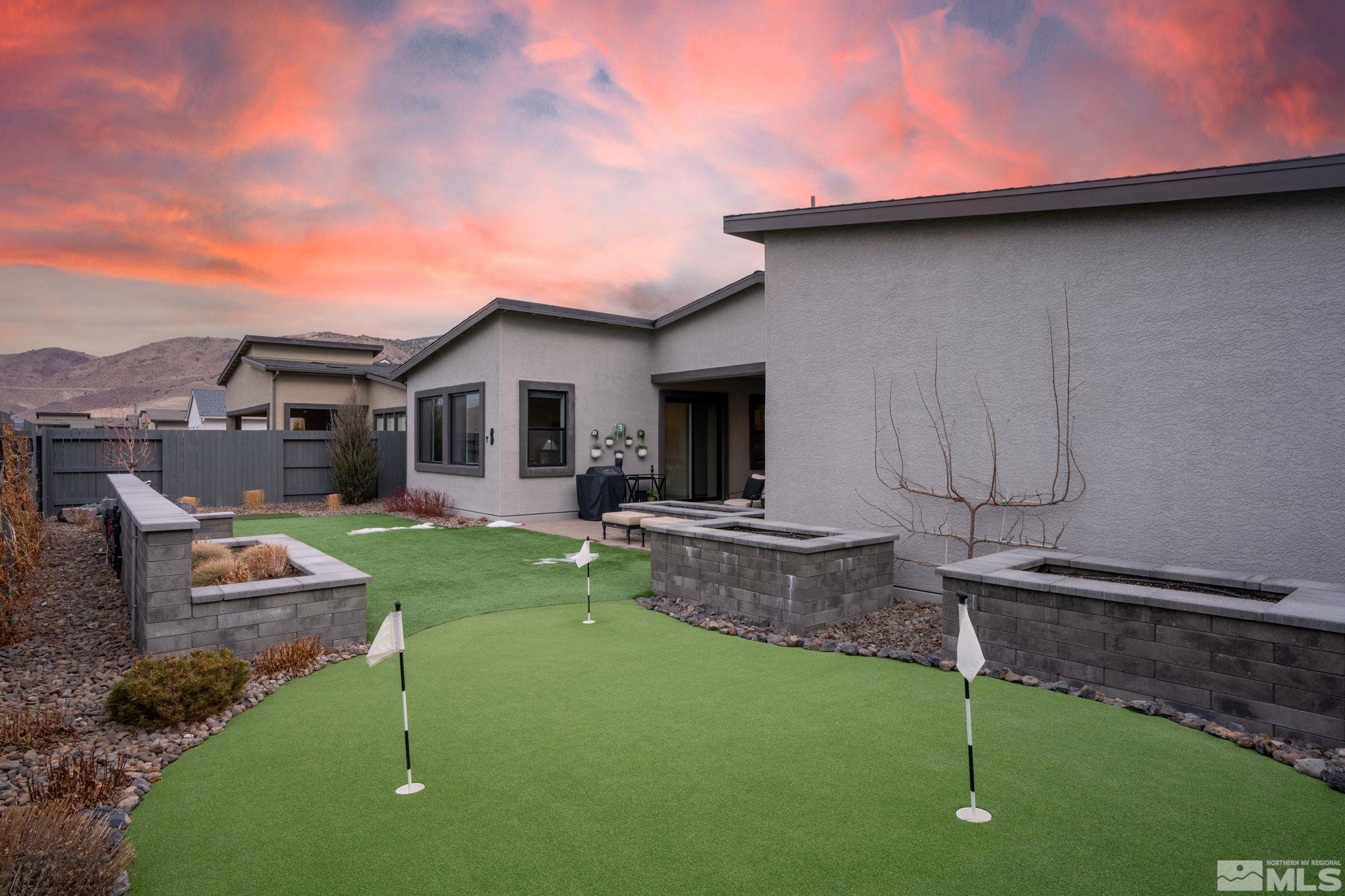 2343 Iron Square Drive Reno, NV 89521 - Photo 29 of 35 a backyard of a house with table and chairs