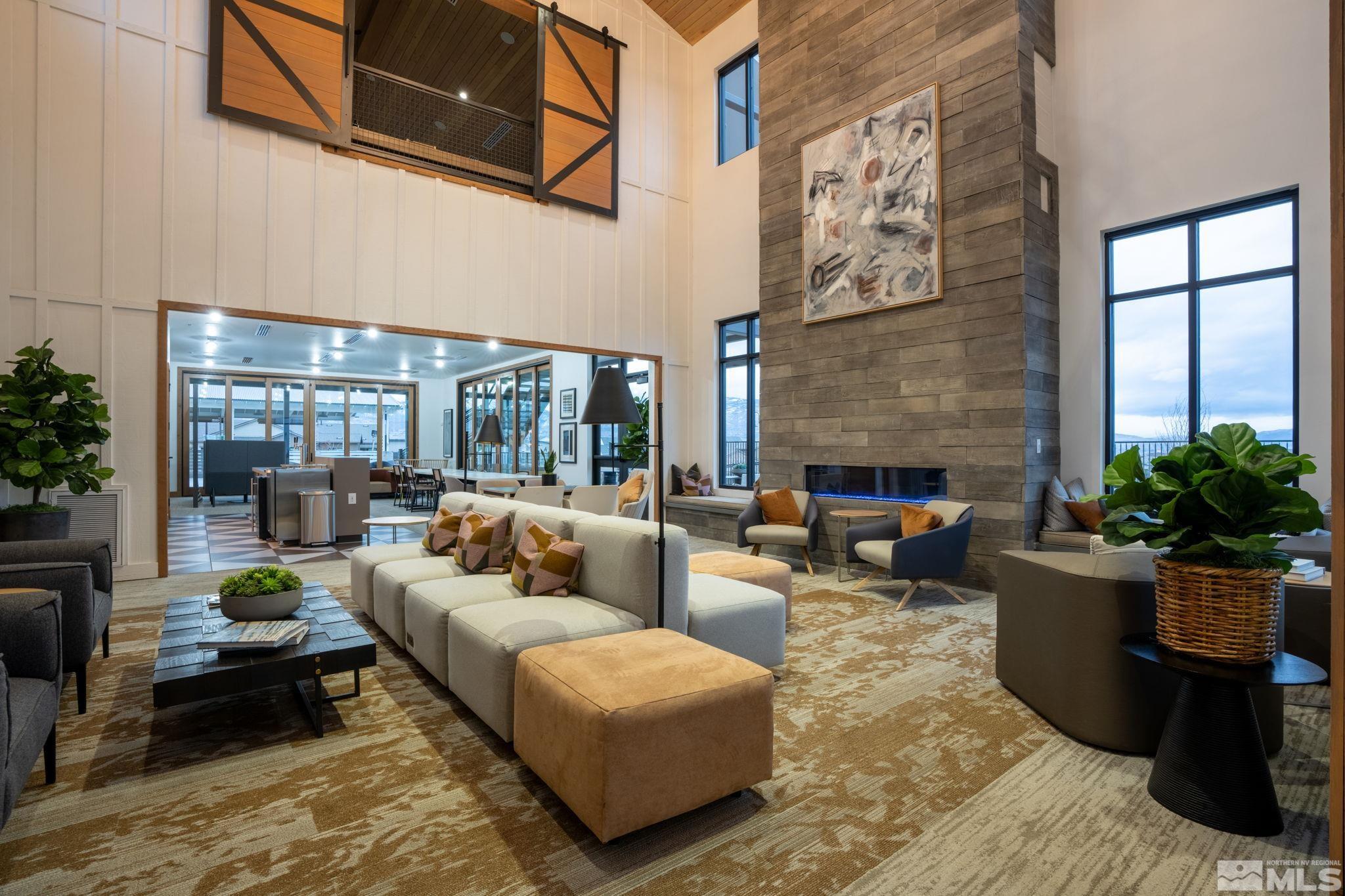 2343 Iron Square Drive Reno, NV 89521 - Photo 33 of 35 a living room with furniture potted plant and a fireplace