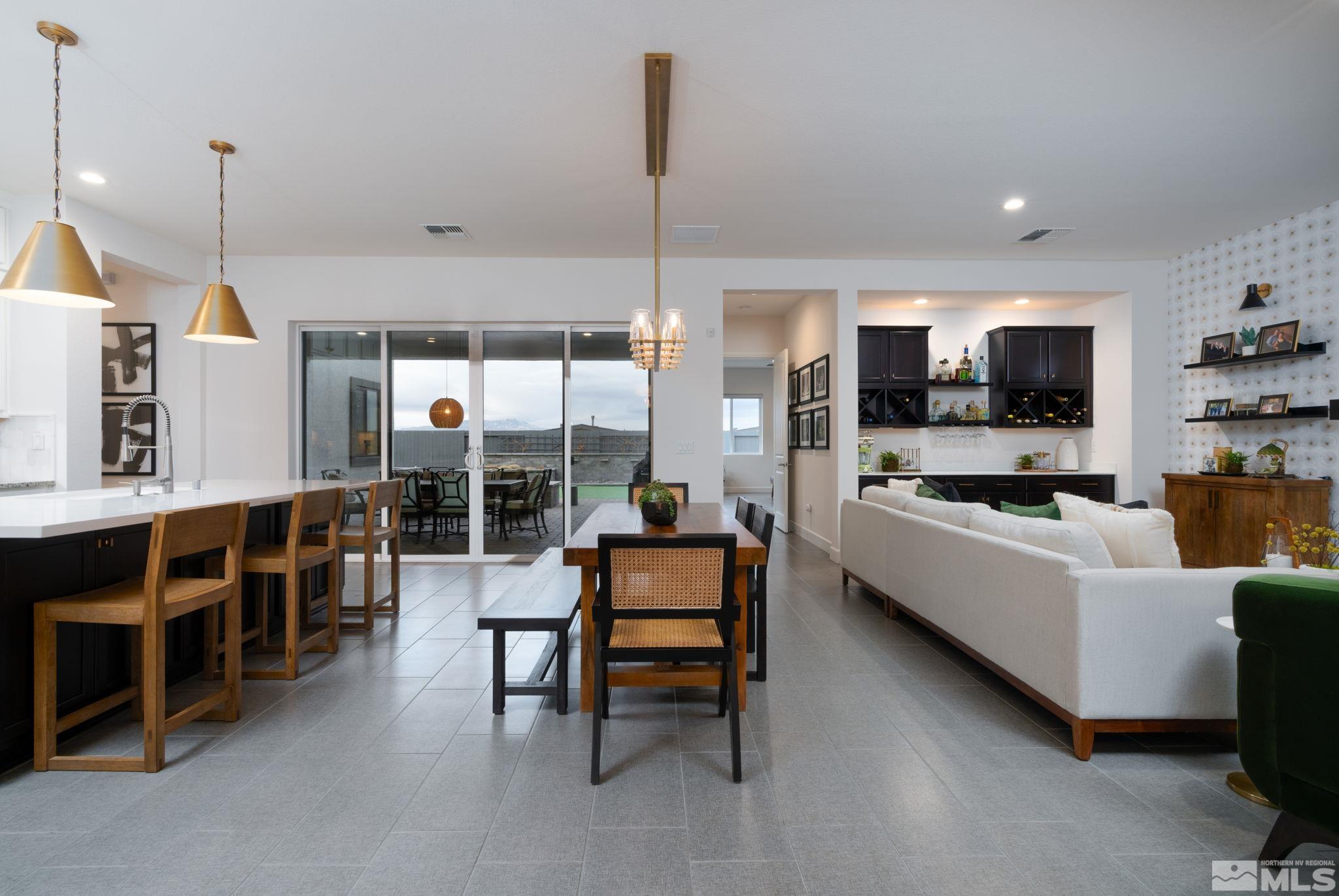 2343 Iron Square Drive Reno, NV 89521 - Photo 5 of 35 a living room with furniture kitchen view and a wooden floor