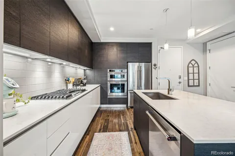 a kitchen with stainless steel appliances a sink and a stove
