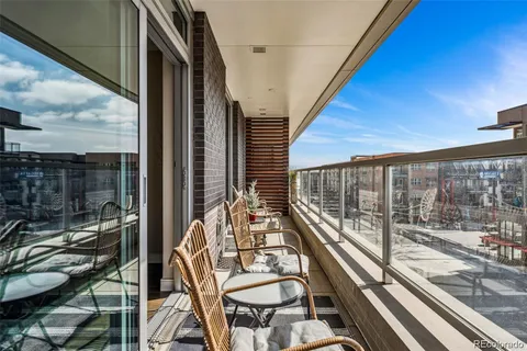 a view of balcony with furniture