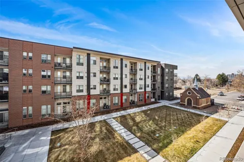 a view of a swimming pool with outdoor seating