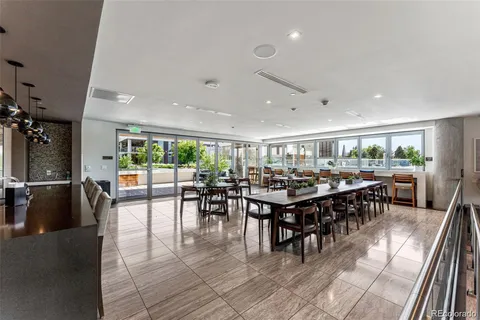 a group of people sitting at tables in a room