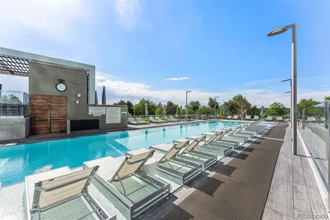 a view of swimming pool with outdoor seating