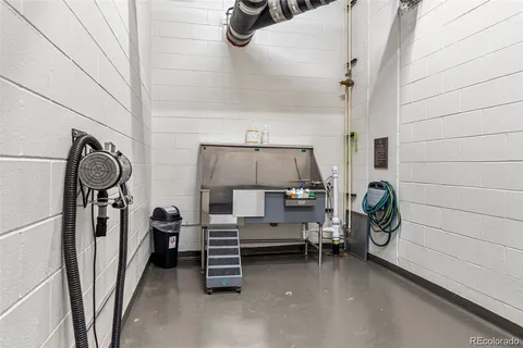 a view of storage and utility room with racks on the wall