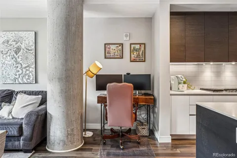 a view of dining room with furniture and wooden floor