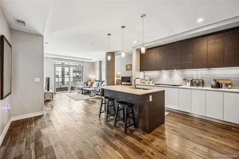 a large kitchen with a table and chairs in it